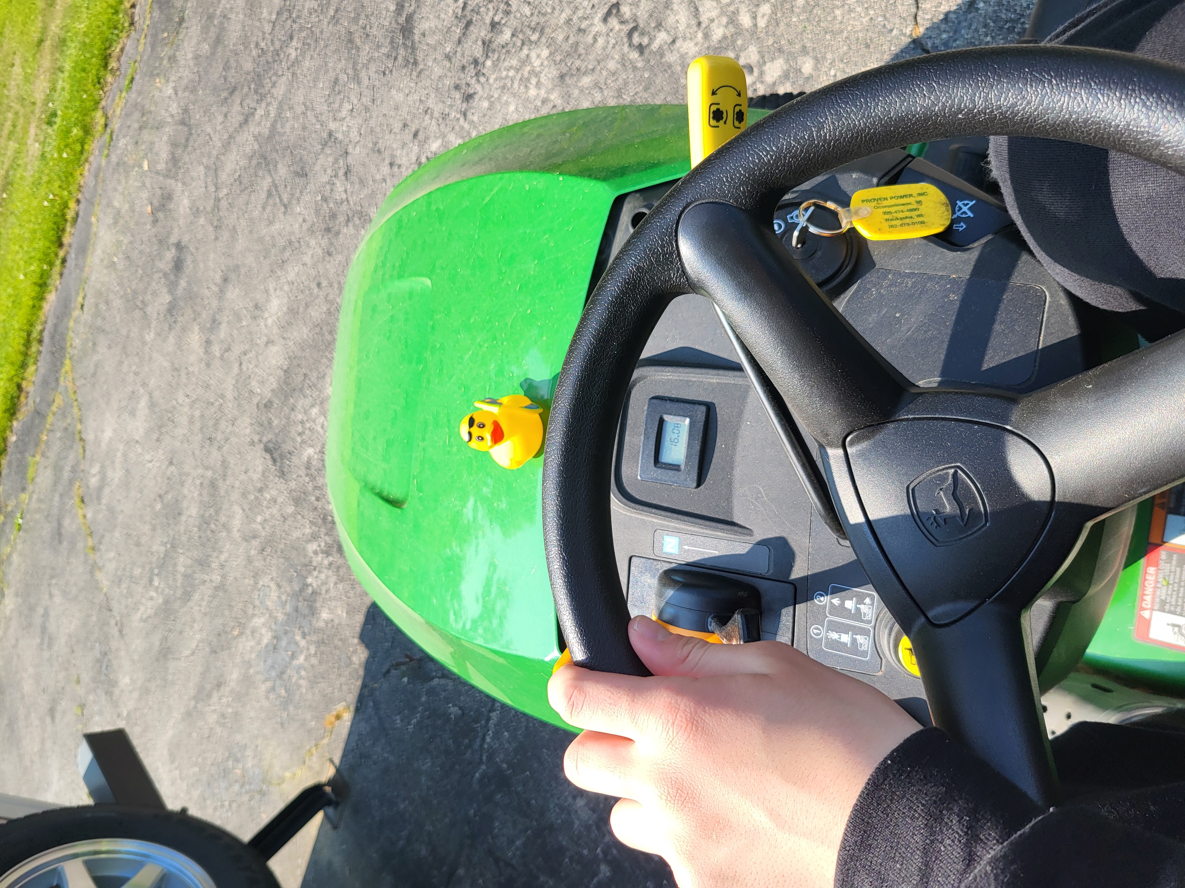 Gerald sitting on a lawnmower