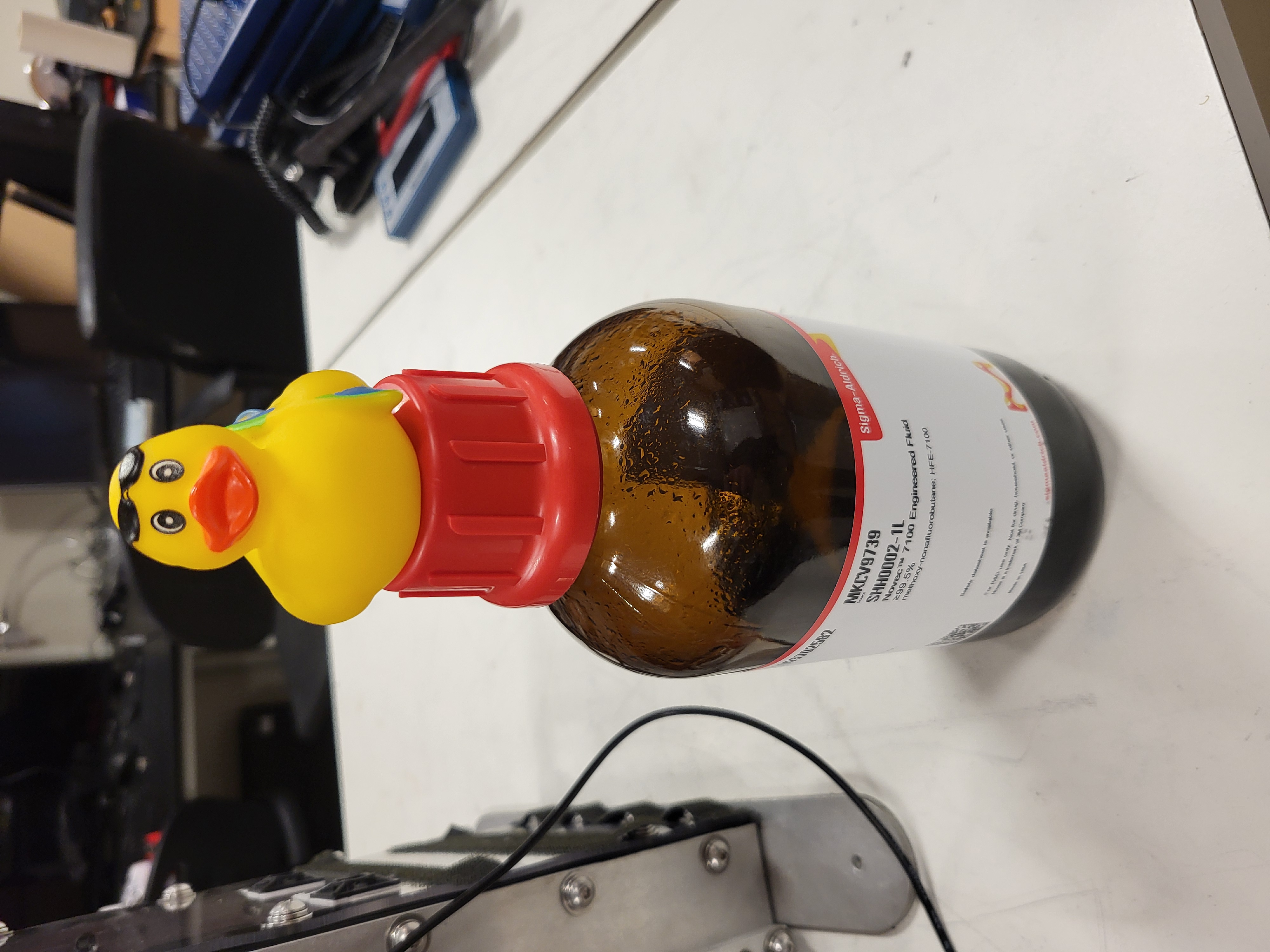 Gerald sitting on a bottle of Novec 7100 Engineered Fluid